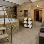 Private wellness at Resort Mezná with a jacuzzi, sauna, and relaxation area in a natural stone design